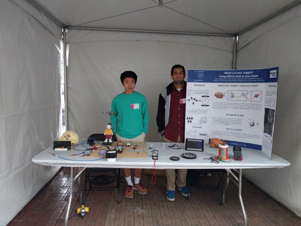Willie Shim and Aditya Gurbani, friends of the lab, help prep the booth!